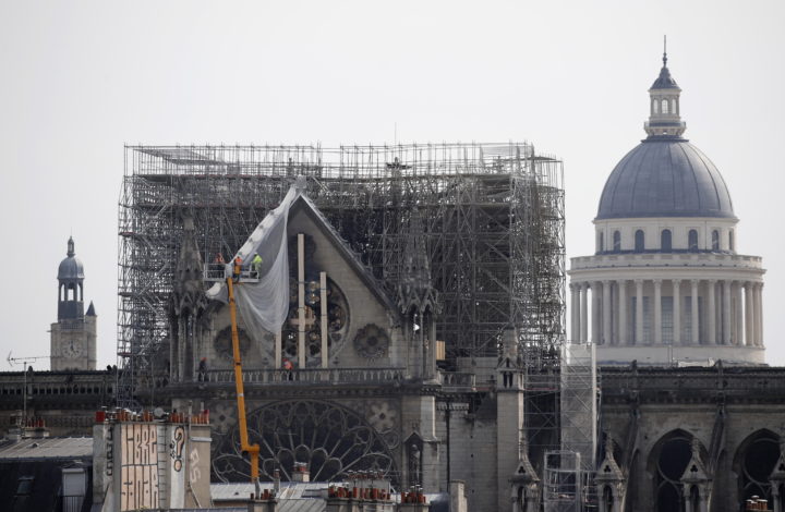 epa07514332 Workers consolidate the North face of Notre-Dame Cathedral threatening to collapse in the aftermath of a fire that devastated the cathedral in Paris, France, 18 April 2019. A fire started in the late afternoon 15 April in one of the most visited monuments of the French capital.  EPA/YOAN VALAT