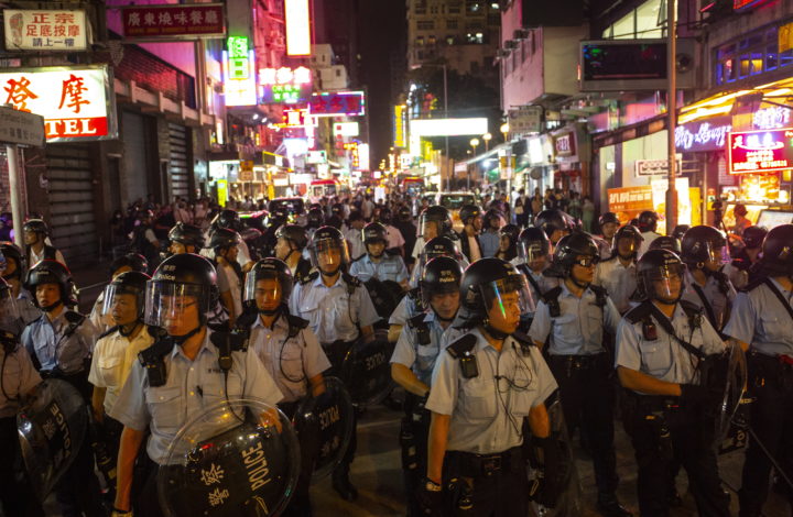 epa07701739 Riot police officers stand guard while protesters continue a demonstration after an anti-extradition bill march in Hong Kong, China, 07 July 2019. Some protesters and police clashed after the march which according to organizers was aimed to spread the spirit of resistance all over Hong Kong Island to Kowloon and even to Mainland China.  EPA/CHAN LONG HEI