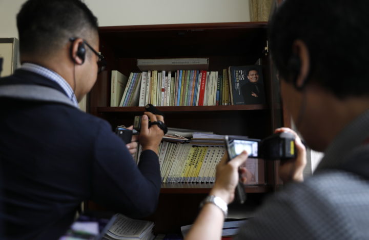epa07688565 Journalists film books in a cabinet in a hostel room at the Party School of the Central Committee of the Communist Party of China (CCPS) during a visit organised for foreign journalists in Beijing, China, 26 June 2019 (issued 02 July 2019). The 86-year-old party school is an important institution for the Communist Party of China (CPC) for the training and education of its cadres and cultivation of government elites.  EPA/HOW HWEE YOUNG CHINA OUT