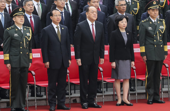 New Macao Special Administrative Region Chief Executive Ho Lat Seng (C) during the raise of the flag cerimonies during the Macao Special Administrative Region of the People's Republic of China 20th anniversary celebrations at Lotus Flower Square in Macao, Chine, 20 December 2019. Macao was governed by Portugal until 1999 when it was transferred to China. As a special administrative region, Macao maintains separate governing and economic systems from that of mainland China JOÃO RELVAS/LUSA